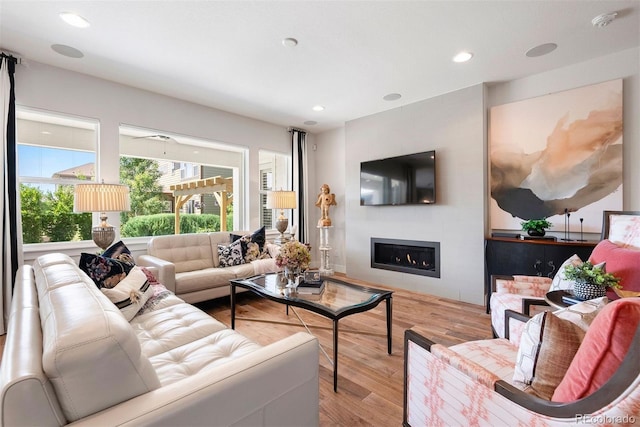 4142 Saltbrush Ct, Loveland, CO 80538 - living room featuring wood finished floors, a fireplace, and recessed lighting