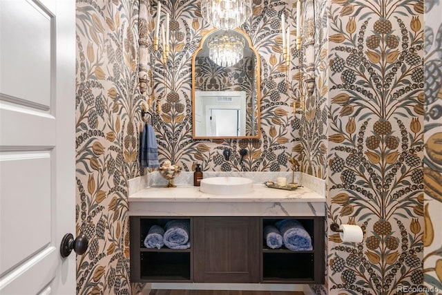 4142 Saltbrush Ct, Loveland, CO 80538 - bathroom featuring wallpapered walls and vanity