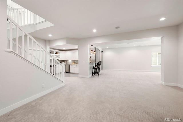 4142 Saltbrush Ct, Loveland, CO 80538 - living room featuring light carpet, stairway, and recessed lighting