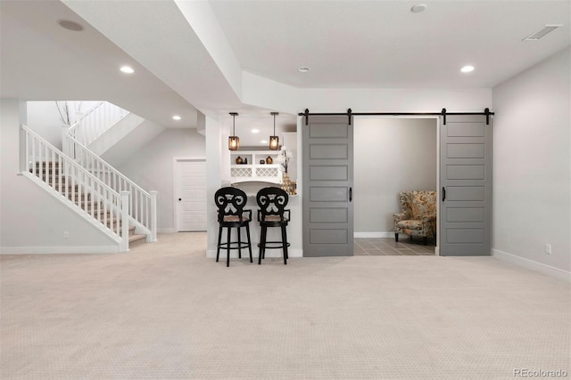 4142 Saltbrush Ct, Loveland, CO 80538 - carpeted living room featuring a barn door, recessed lighting, and stairs