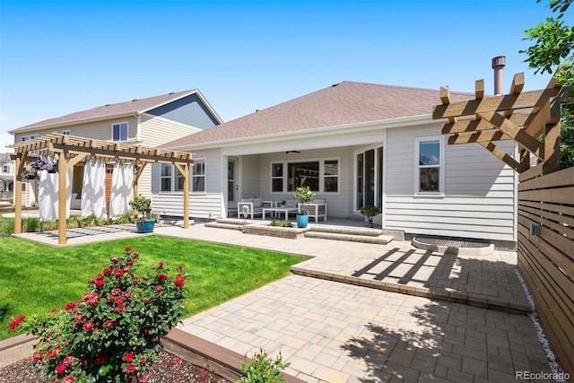 4142 Saltbrush Ct, Loveland, CO 80538 - back of house featuring a pergola, a patio area, a lawn, and a ceiling fan