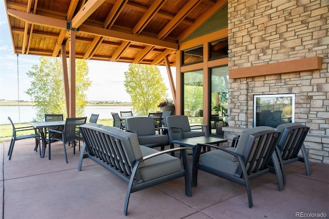 4142 Saltbrush Ct, Loveland, CO 80538 - view of patio featuring outdoor dining area and a water view