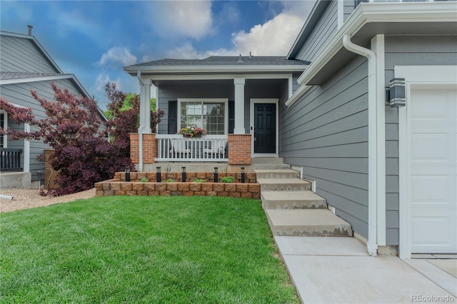 9884 Sydney Ln, Highlands Ranch, CO 80130 - entrance to property featuring a lawn, a porch, and an attached garage