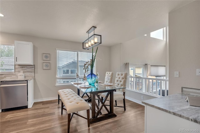 9884 Sydney Ln, Highlands Ranch, CO 80130 - dining area with light wood-style flooring and baseboards