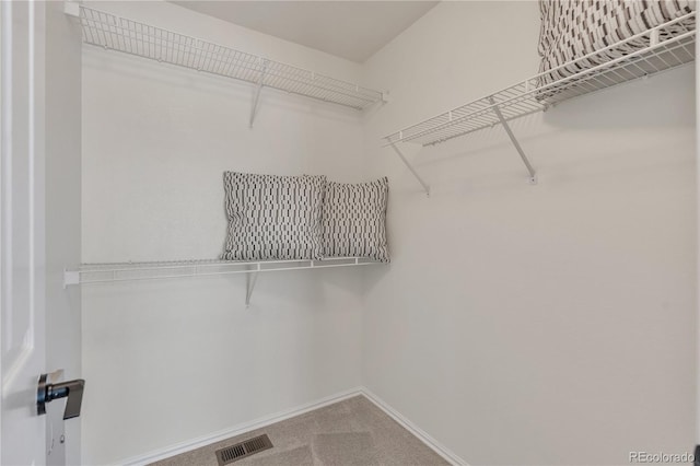 9884 Sydney Ln, Highlands Ranch, CO 80130 - walk in closet with carpet floors