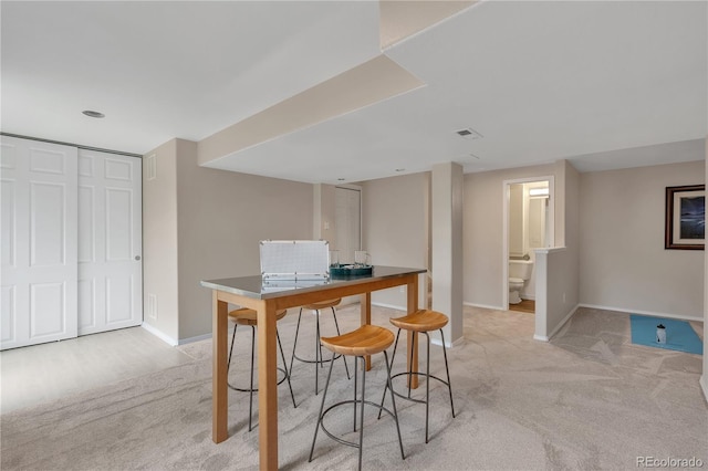 9884 Sydney Ln, Highlands Ranch, CO 80130 - dining area featuring light carpet and baseboards