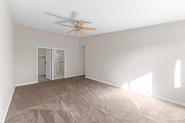 spare room with carpet flooring and ceiling fan