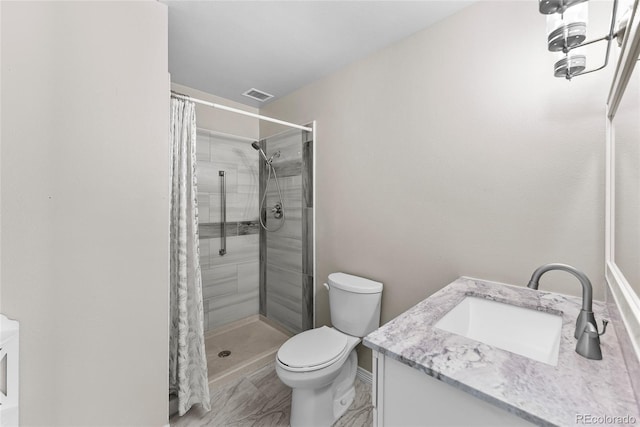 bathroom with vanity, toilet, and curtained shower