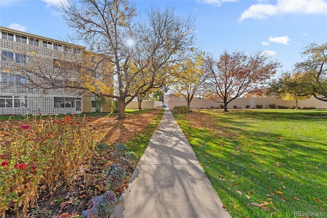 view of home's community featuring a lawn