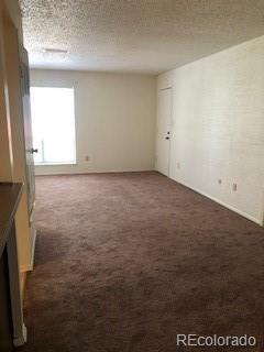 2355 E Geddes Ave Unit G24, Centennial, CO 80122 - unfurnished room featuring dark carpet