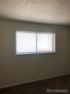 2355 E Geddes Ave Unit G24, Centennial, CO 80122 - empty room with a textured ceiling