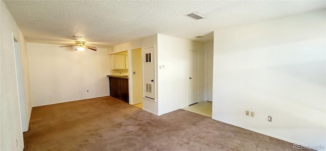 2355 E Geddes Ave Unit G24, Centennial, CO 80122 - unfurnished room featuring light carpet, a ceiling fan, and a textured ceiling