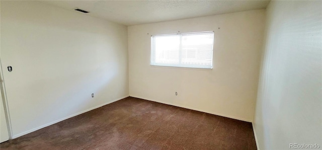 2355 E Geddes Ave Unit G24, Centennial, CO 80122 - empty room with dark carpet and baseboards