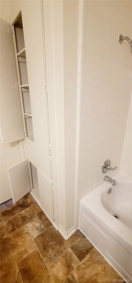 2355 E Geddes Ave Unit G24, Centennial, CO 80122 - full bath featuring bathtub / shower combination and stone finish floors