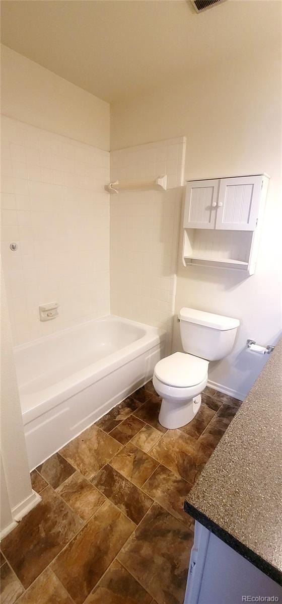 2355 E Geddes Ave Unit G24, Centennial, CO 80122 - bathroom with vanity, tub / shower combination, and stone finish flooring