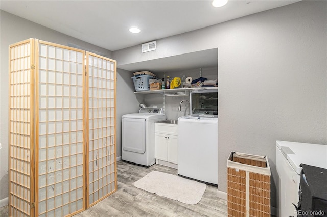 400 W Midway Blvd, Broomfield, CO 80020 - laundry area featuring cabinet space, independent washer and dryer, light wood-style flooring, and recessed lighting