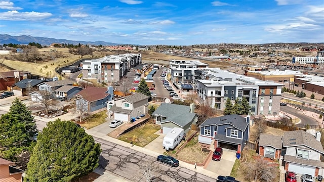 aerial view featuring a mountain view and a residential view