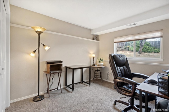 office space featuring carpet floors, baseboards, and visible vents