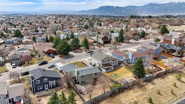 drone / aerial view featuring a residential view and a mountain view