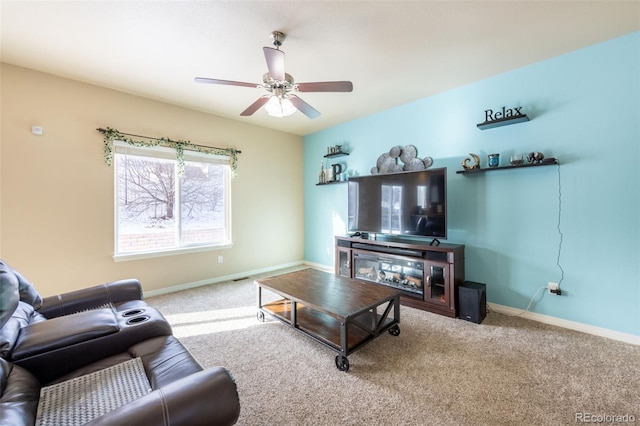 living room featuring ceiling fan and carpet