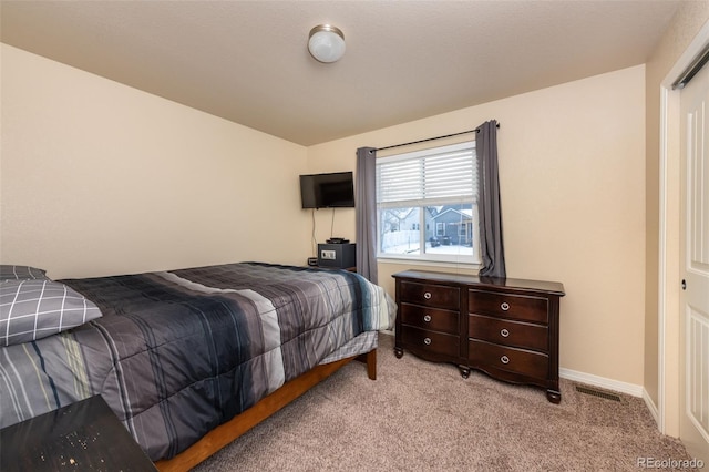 bedroom with light carpet and vaulted ceiling