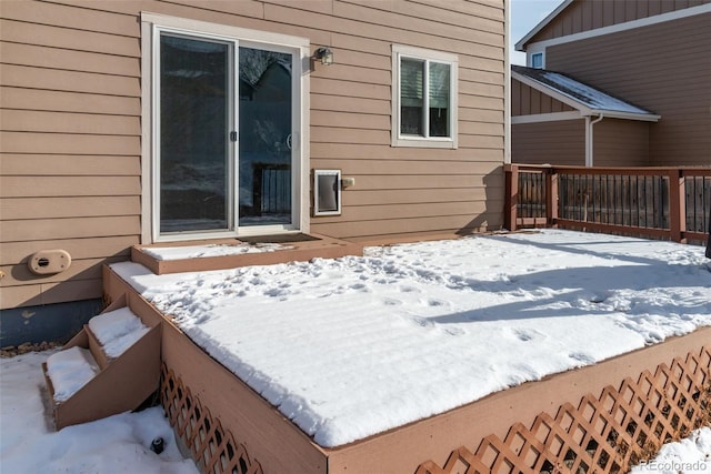 view of snow covered deck