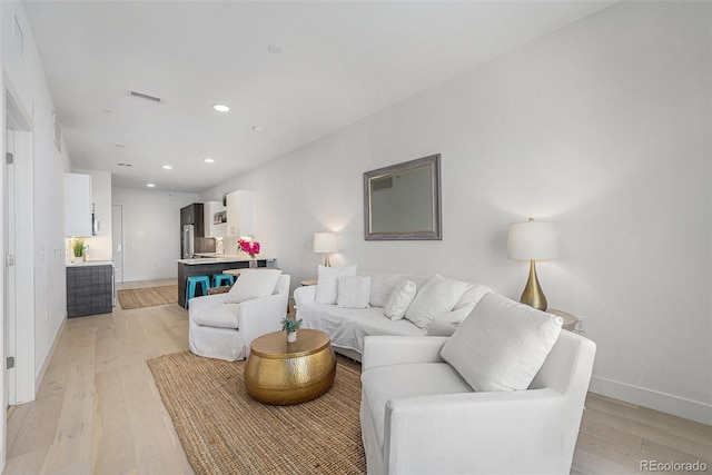2530 Lawrence St Unit Ra301, Denver, CO 80205 - living room featuring light wood-style flooring and recessed lighting