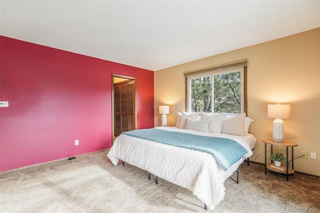 bedroom with carpet floors and a closet