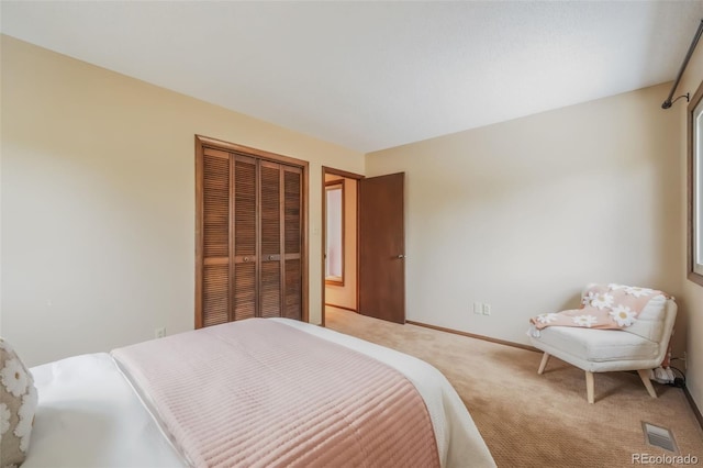 carpeted bedroom with a closet