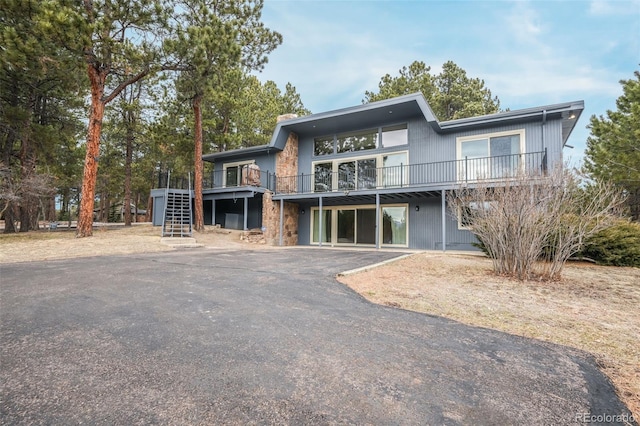 view of front of property with a wooden deck