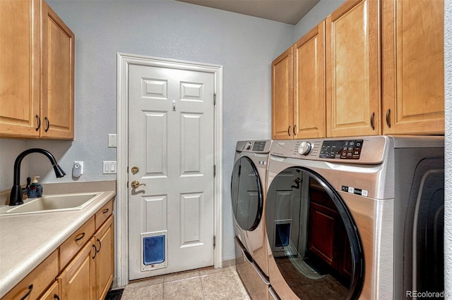 581 Stonemont Dr, Castle Pines, CO 80108 - washroom with cabinet space, independent washer and dryer, a textured wall, and light tile patterned floors