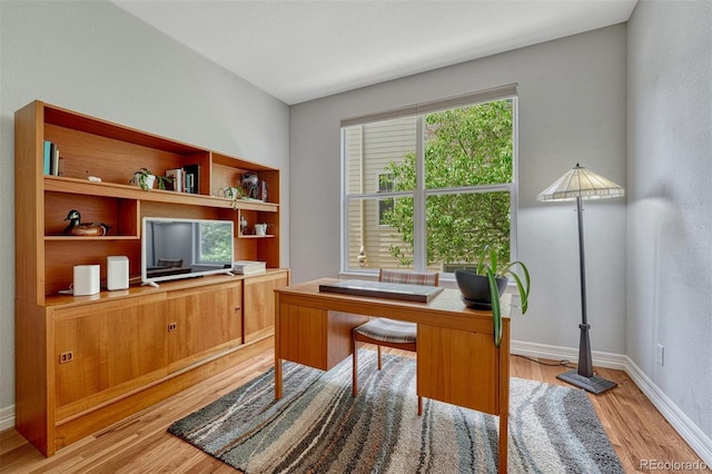 581 Stonemont Dr, Castle Pines, CO 80108 - office with light wood-style floors and baseboards