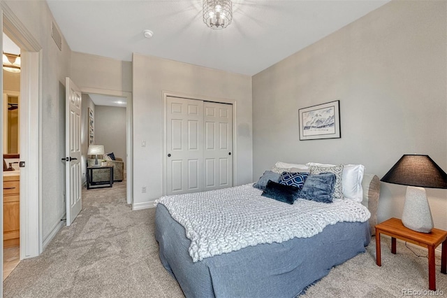 581 Stonemont Dr, Castle Pines, CO 80108 - bedroom featuring light colored carpet, a closet, and baseboards