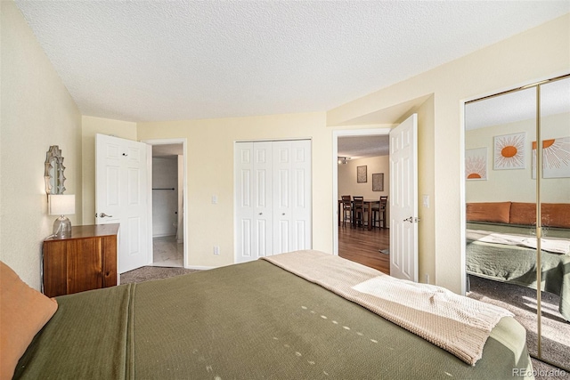 2 Acoma St Unit 11, Denver, CO 80223 - bedroom featuring carpet floors and a textured ceiling