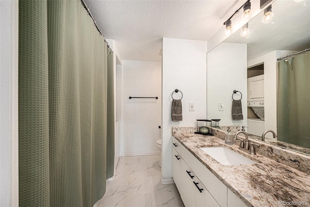 2 Acoma St Unit 11, Denver, CO 80223 - bathroom featuring marble finish flooring, vanity, toilet, a textured ceiling, and a shower with curtain