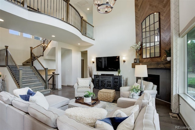 23451 E Rockinghorse Pkwy, Aurora, CO 80016 - living room with a high ceiling, stairs, a chandelier, wood finished floors, and recessed lighting