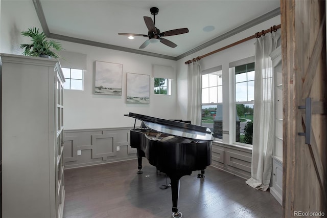 23451 E Rockinghorse Pkwy, Aurora, CO 80016 - sitting room with crown molding, plenty of natural light, a decorative wall, a ceiling fan, and wainscoting