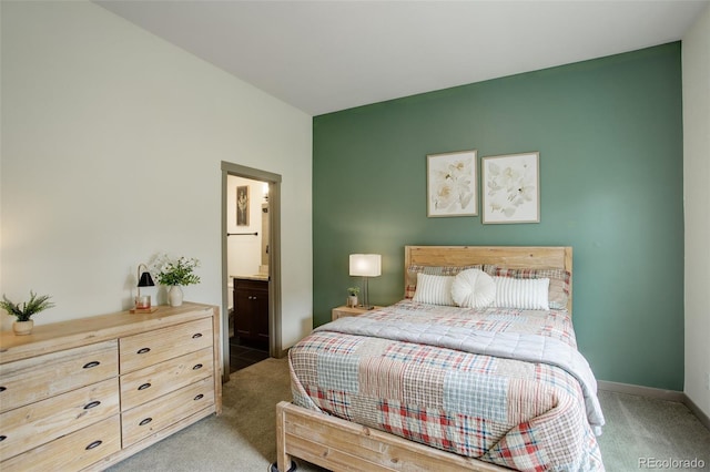 23451 E Rockinghorse Pkwy, Aurora, CO 80016 - bedroom with light carpet, ensuite bath, and baseboards