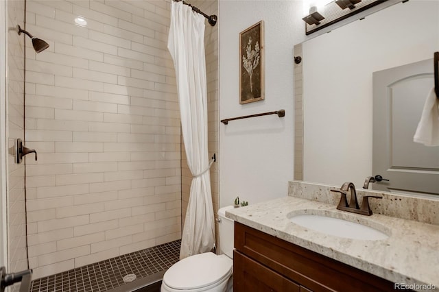 23451 E Rockinghorse Pkwy, Aurora, CO 80016 - bathroom featuring a shower stall, vanity, and toilet