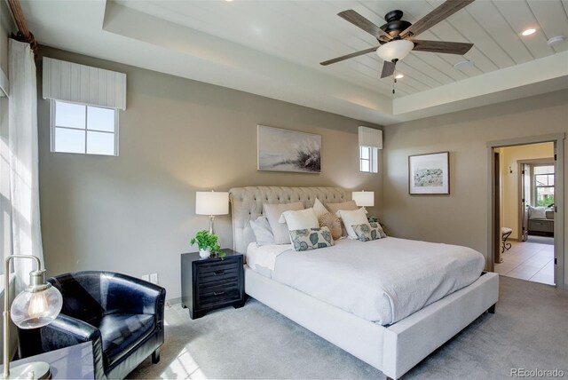 23451 E Rockinghorse Pkwy, Aurora, CO 80016 - bedroom featuring carpet flooring, a tray ceiling, recessed lighting, and ceiling fan