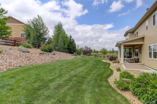 23451 E Rockinghorse Pkwy, Aurora, CO 80016 - view of yard featuring a patio area and an outdoor hangout area