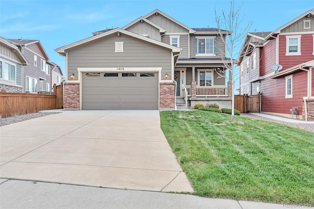 craftsman inspired home featuring a front yard, a garage, and a porch