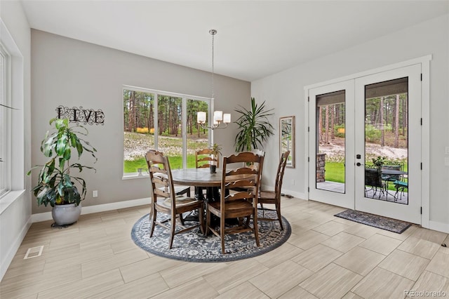 10525 Wild Fox Pl, Franktown, CO 80116 - dining space with a chandelier and french doors