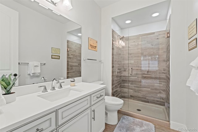 10525 Wild Fox Pl, Franktown, CO 80116 - full bathroom with vanity, a shower stall, recessed lighting, and wood finished floors