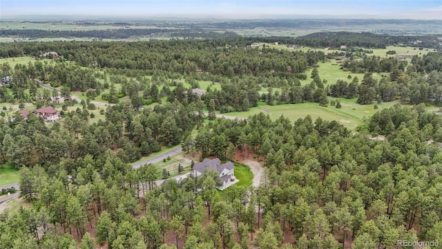 10525 Wild Fox Pl, Franktown, CO 80116 - aerial overview of property's location with a heavily wooded area