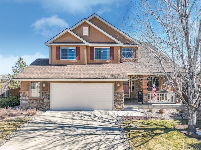 view of front of property featuring a porch, stone siding, driveway, and a shingled roof