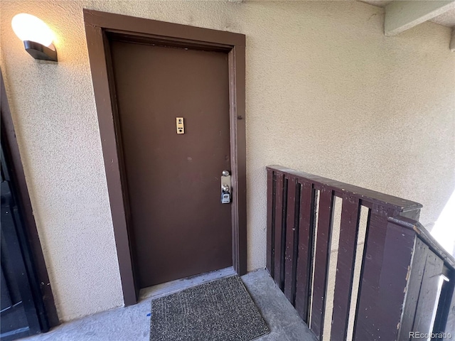 9995 E Harvard Ave Unit 261, Denver, CO 80231 - doorway to property featuring stucco siding