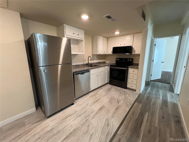 9995 E Harvard Ave Unit 261, Denver, CO 80231 - kitchen with black appliances, white cabinets, light wood finished floors, open shelves, and recessed lighting