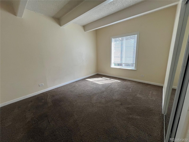 9995 E Harvard Ave Unit 261, Denver, CO 80231 - carpeted empty room with beam ceiling and a textured ceiling