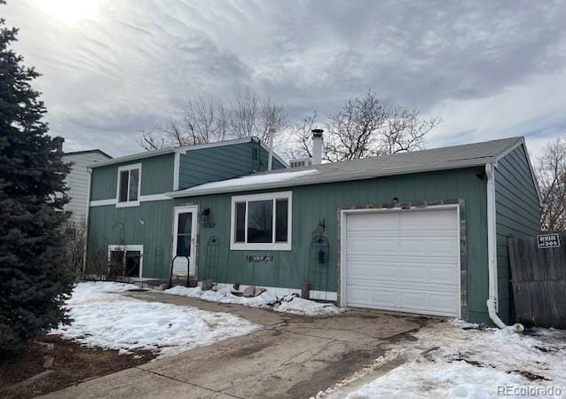 split level home featuring a garage